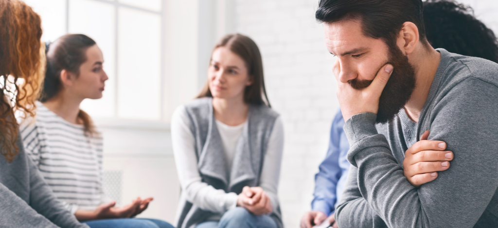 Being in a Relationship with Person Struggling with Addiction - Emerald Isle - Individuals in inpatient rehab are discussing how to be in a relationship with a person struggling with addiction.